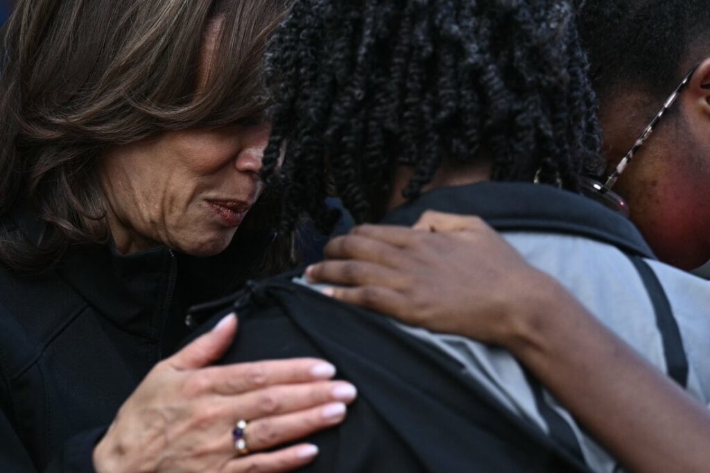 Vice President Harris comforts a woman when she toured the damage from Hurricane Helene in the Meadowbrook neighborhood of Augusta, Ga., October 2.